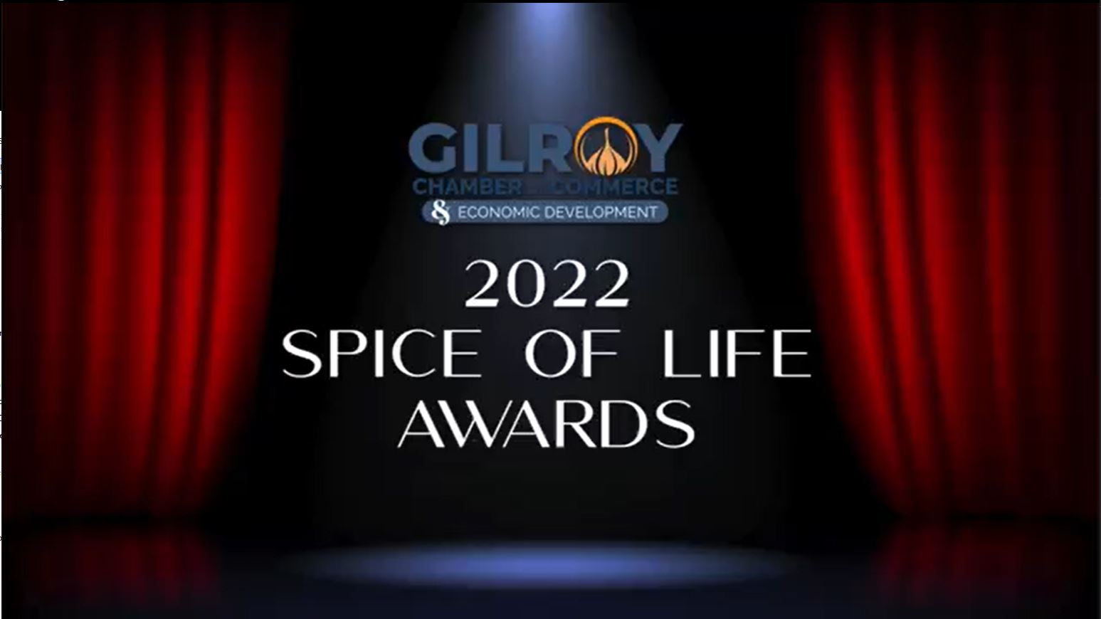 Spice of Life Awards banner with red theatrical drapes and a spotlight illuminating center stage and text that reads 2022 Spice of Life Awards
